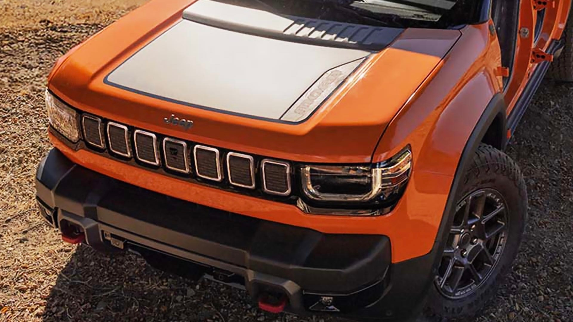 Capot et calandre du Jeep Recon VEB 2026 orange avec finition noire et détails Trail-Rated. Vue rapprochée avant.